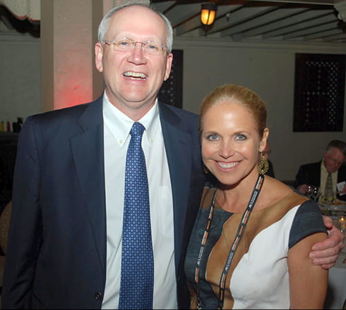 Raymond DuBois stands with Katie Couric