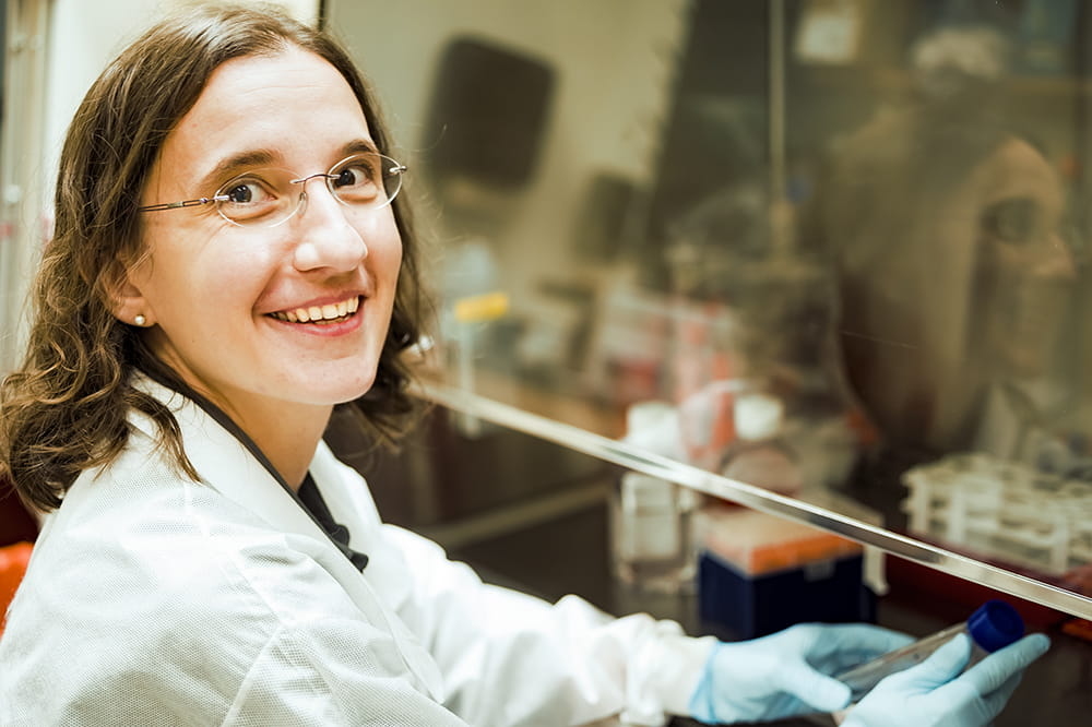 Mariana Pehar smiles in her lab 