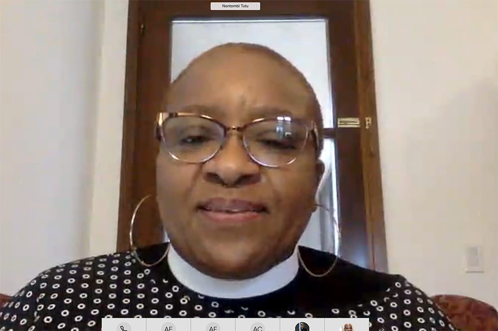 a screenshot from a teleconference shows Rev. Tutu in front of  her computer
