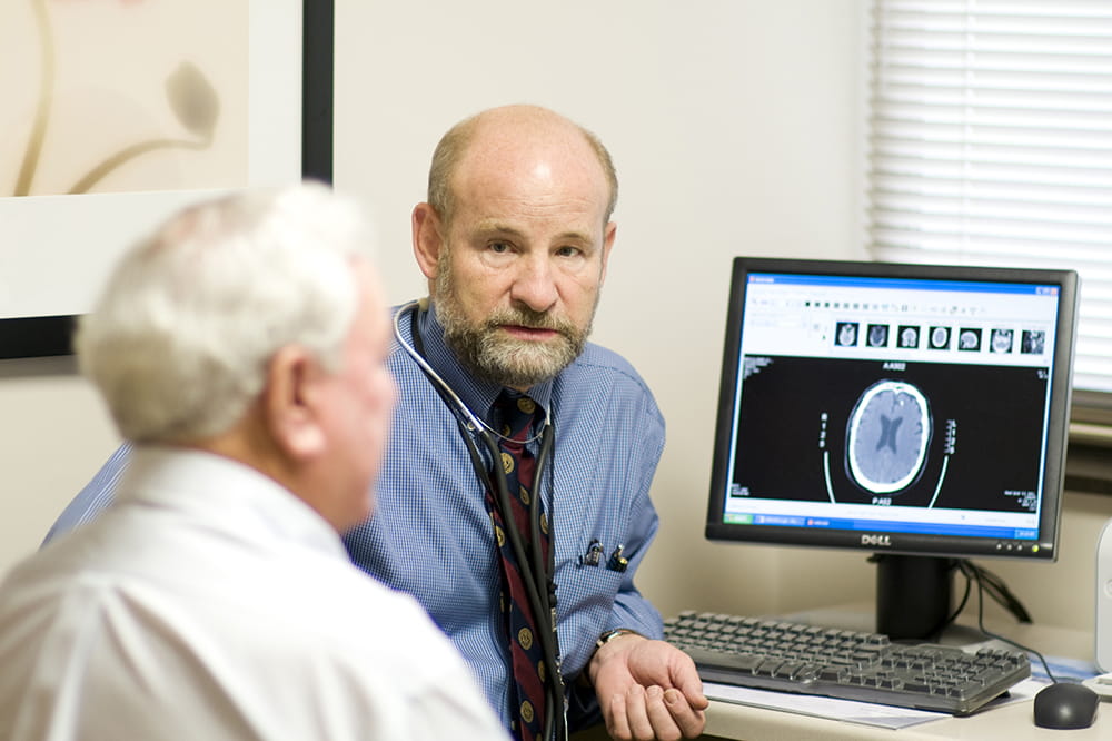 Dr. Robert Adams of MUSC consults with a colleague.