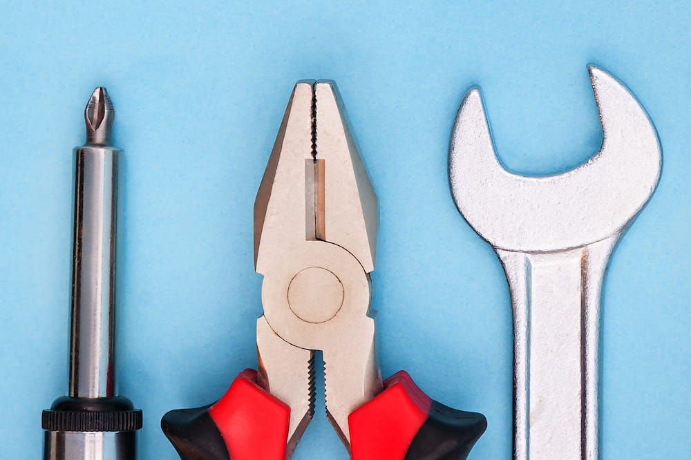 Various tools on blue blackground. Image by Dmitry Gladkov. Licensed from iStock.