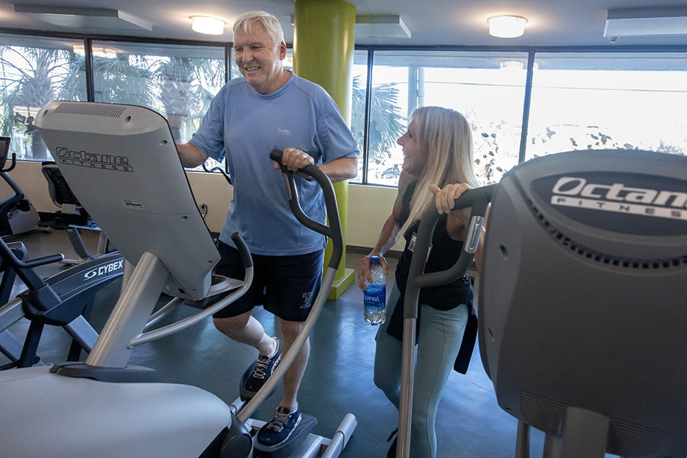 Cole works out at the Wellness center with his trainer