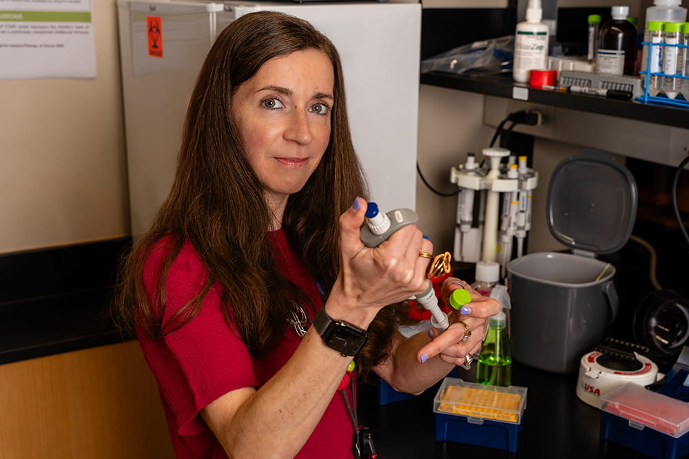 portrait of immunologist Silvia Guglietta in her lab at Hollings Cancer Center