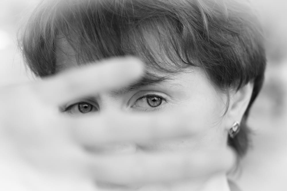 A woman in a very depressed mood covers his face. Photo by AS Discha. Licensed from istockphoto.com