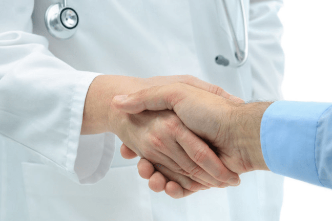 close-up of a handshake between a physician and a researcher