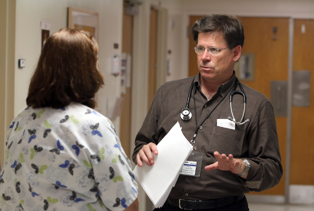 MUSC's Dr. Patrick Flume talking with a colleague